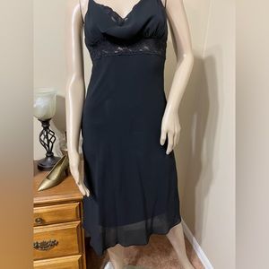 Cute little black dress with lacey look under chest area and at top.  Chiffon